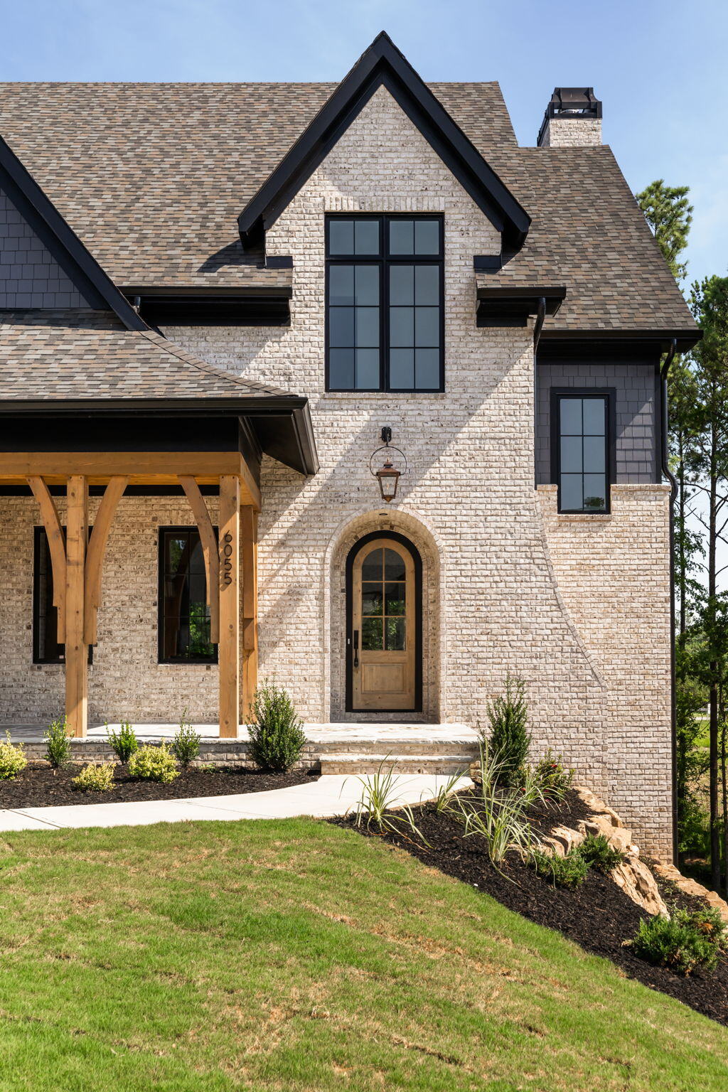 Curved Entry Door with Covered Porch and Dormer Windows in Milton GA