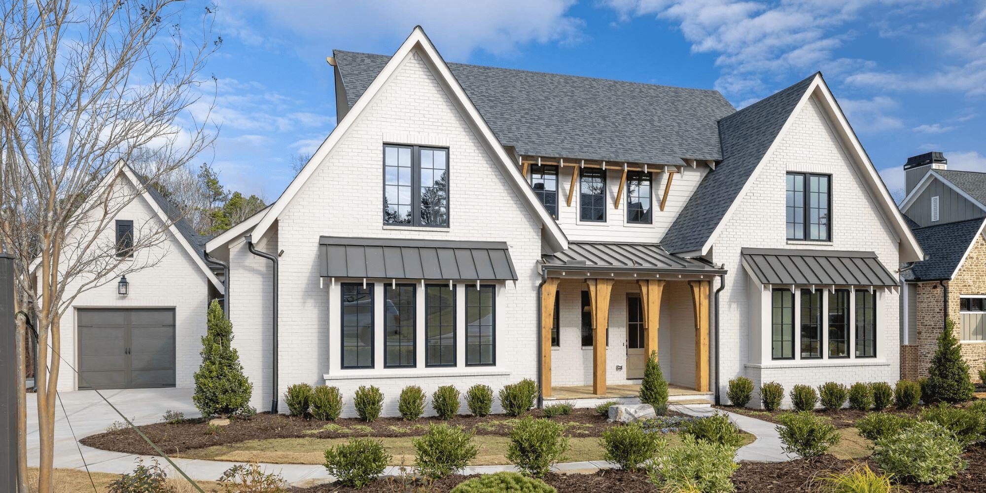Modern luxury home exterior with detached garage in North Metro Atlanta | Why Atlanta is a hotspot for luxury homes | Elevation Building Company