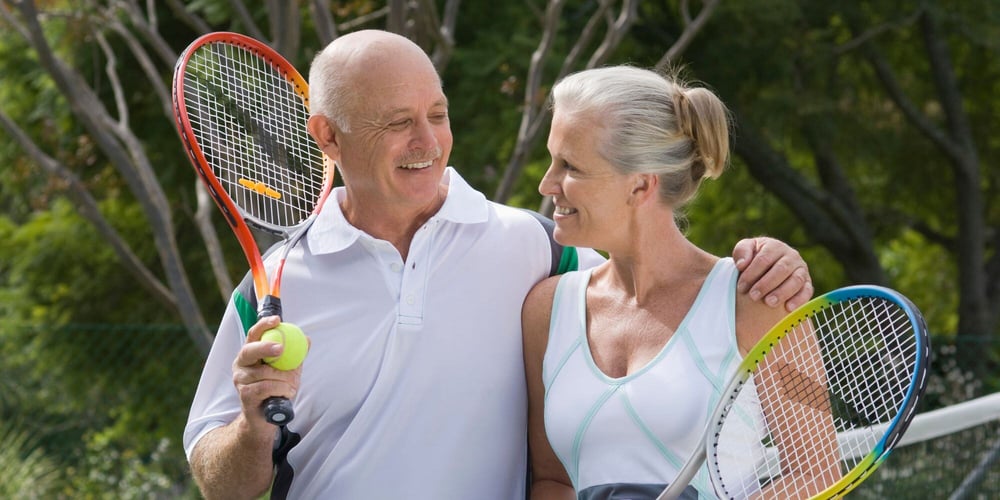 Stock Image of Retirees Playing Tennis in Georgia