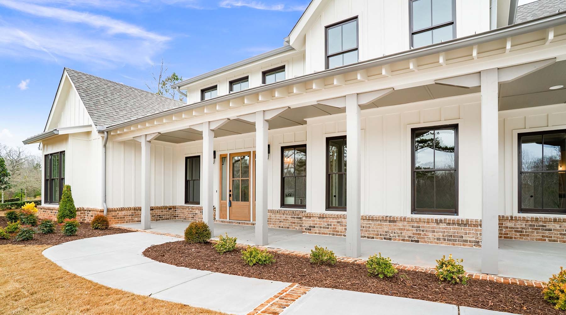 Atlanta custom home with white exterior and patio pergola