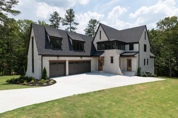 atlanta custom home exterior shot with black roof and gutters
