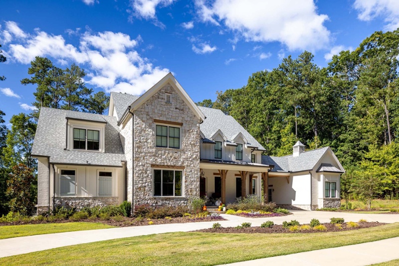 Atlanta custom home with white brick exterior and wood columns
