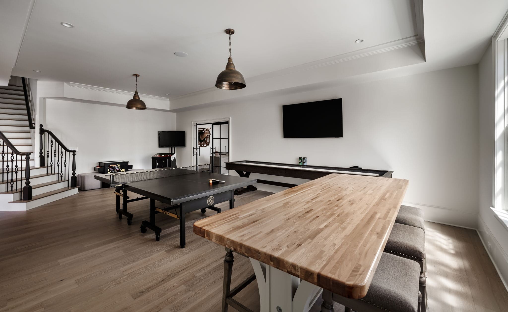 Multifunctional basement space with pool table and tv Elevation Building Company - North Metro Atlanta Builders - Custom home trends