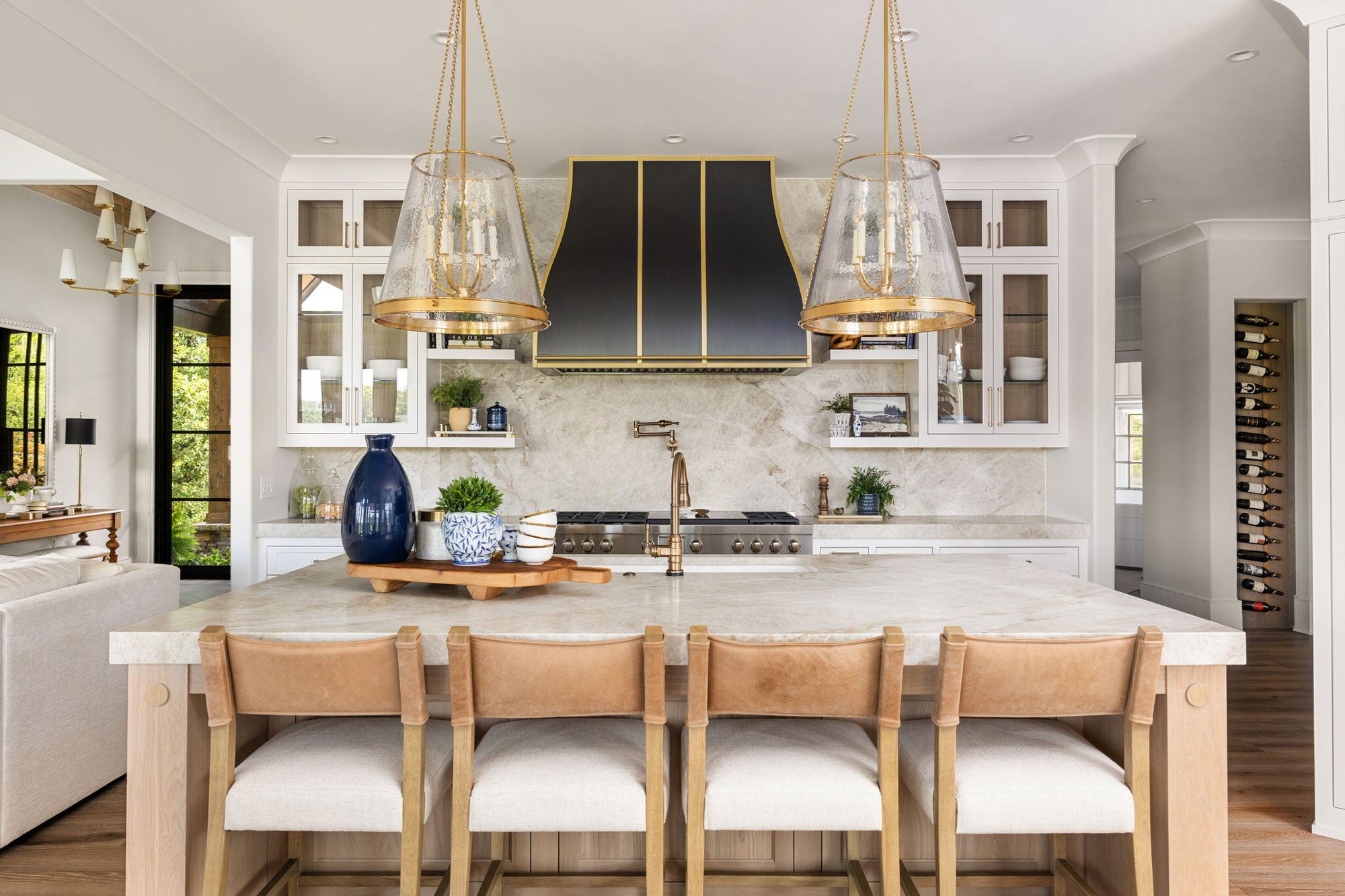 Kitchen Island with Stools and Custom Black Range Hood in Alpharetta Home Remodel